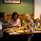 The Obamas and the Bidens eating in a diner